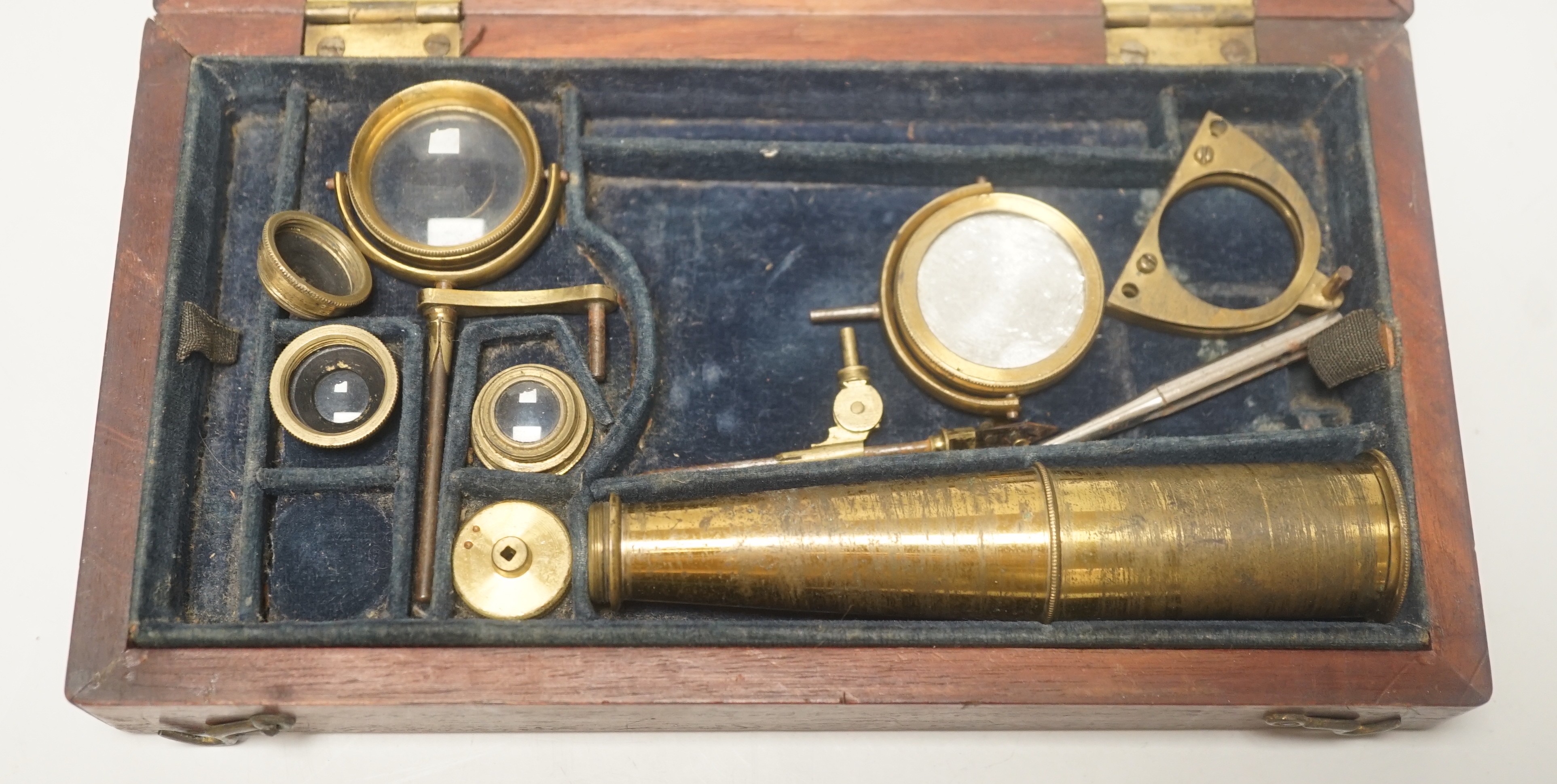 A 19th century monocular microscope, in mahogany case